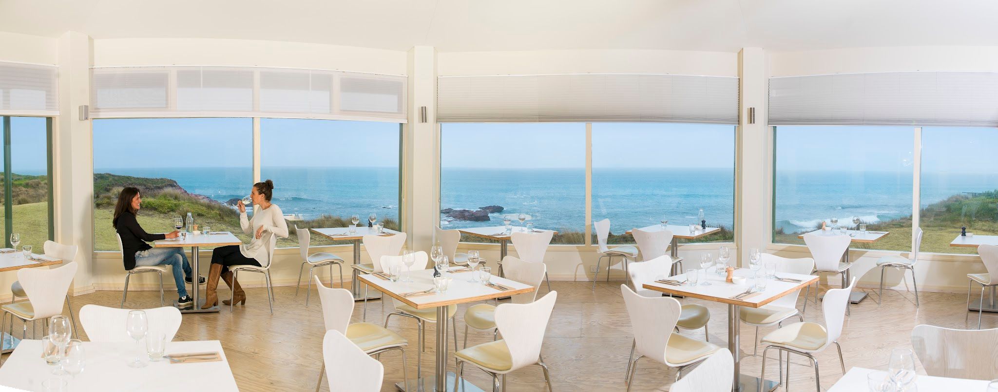 The Cape Kitchen dining room with panoramic floor-to-ceiling windows overlooking the Southern Ocean